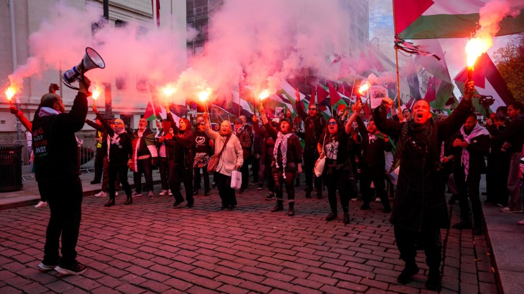 Pro-Palestinian demonstrators march to stadium before Norway vs. Israel match