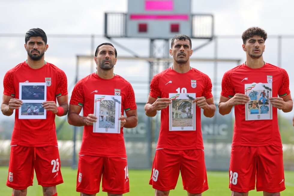 Iranian soccer team pays tribute to children believed to be victims of war before World Cup pre-match