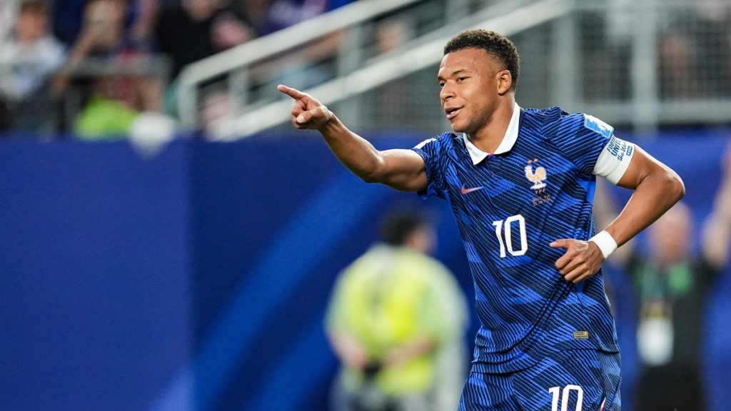 Kylian Mbappé keeps pace with Lionel Messi as weather wreaks havoc on France’s victory